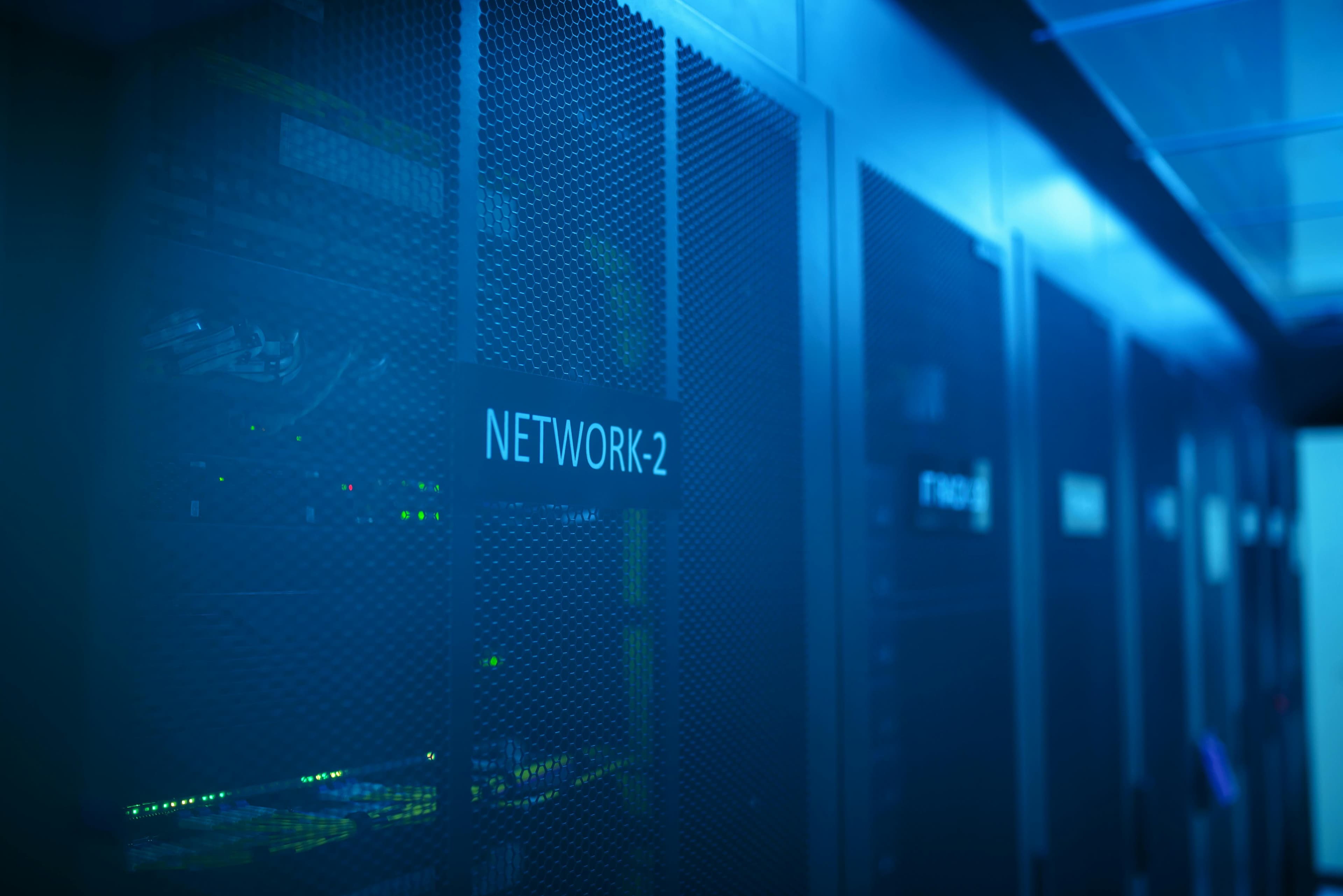Server racks with blue illumination representing reliable webhook event delivery infrastructure